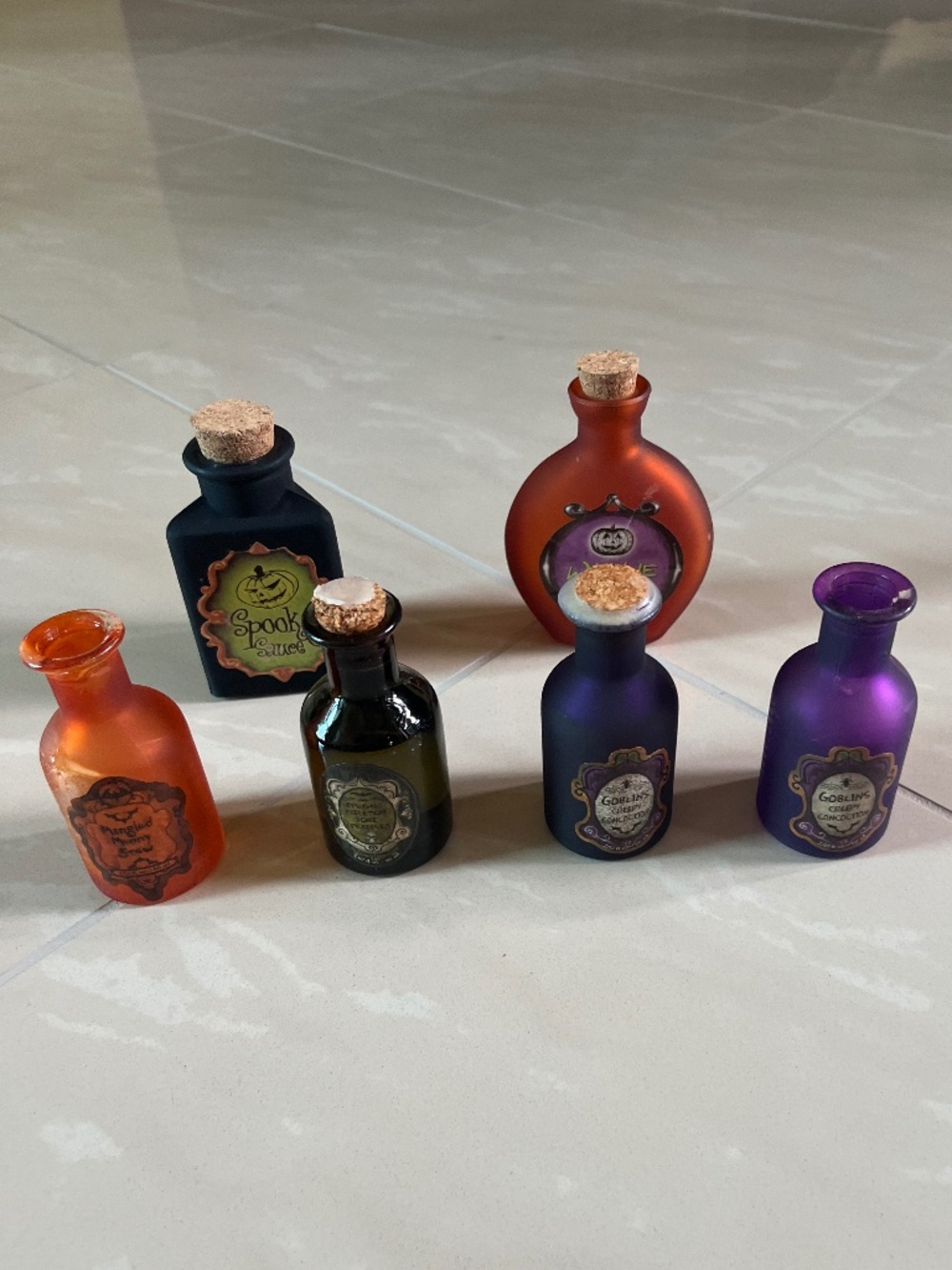 0010 Six-piece Halloween witch’s apothecary and potion bottle décor lot